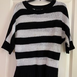 Black and white striped sweater.